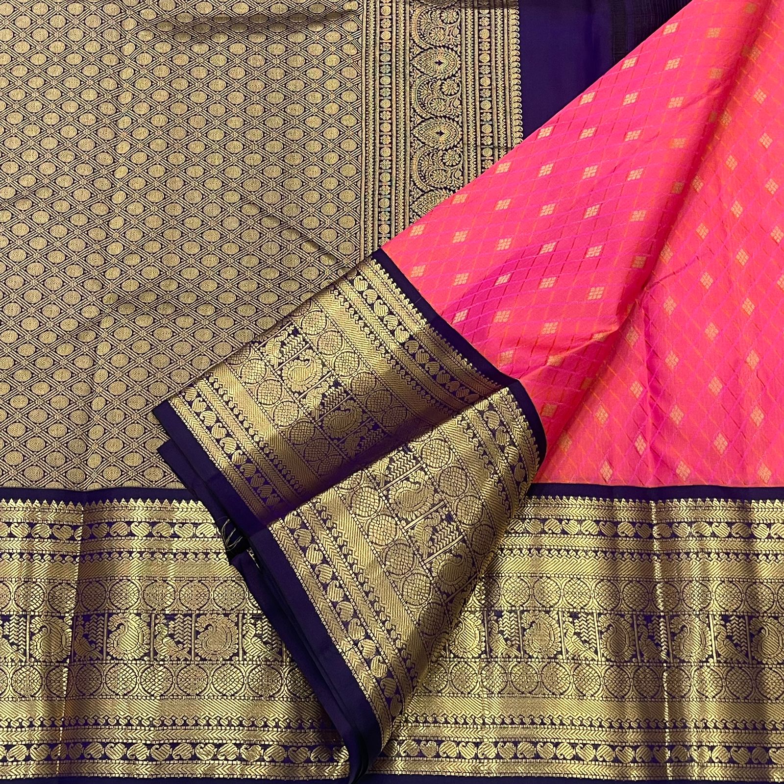Rani Pink Kanjivaram Silk Saree with a Contrast Purple Zari Border.